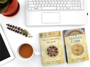 image of brooch and coin books on desk